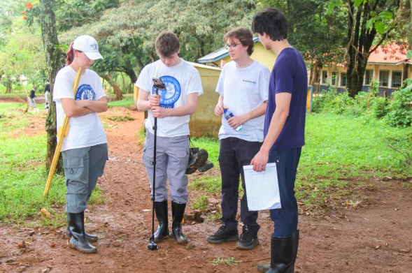 Engineering team reviewing measurements at the school site
